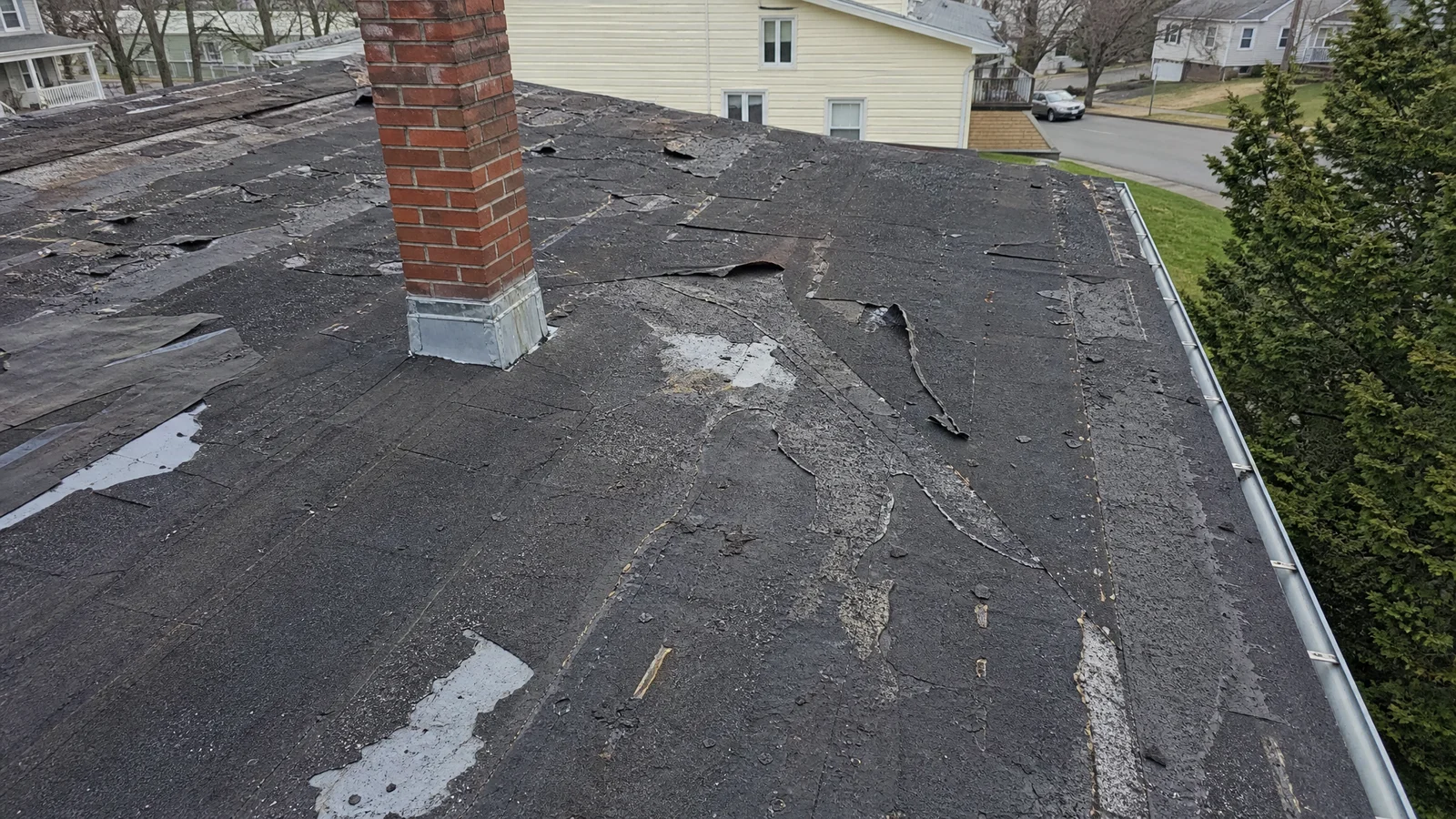 Failing roof with multiple damaged sections in Hartford