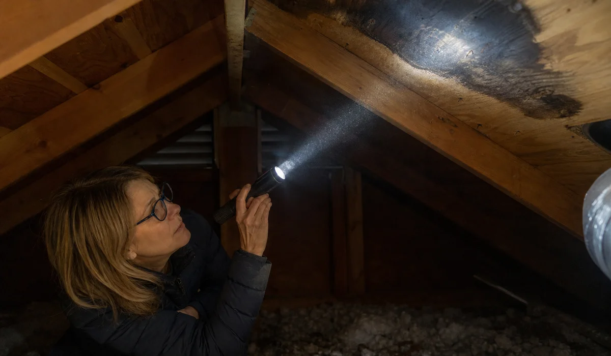 Ceiling water stain being investigated in Hartford attic