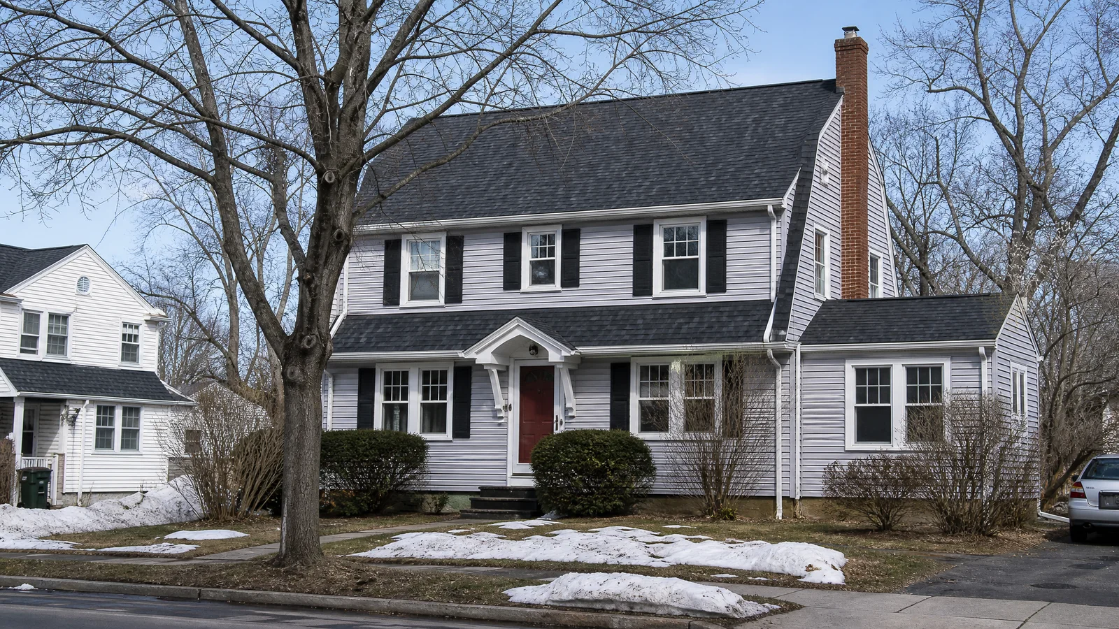 Completed roof replacement on a Connecticut colonial after winter storm damage
